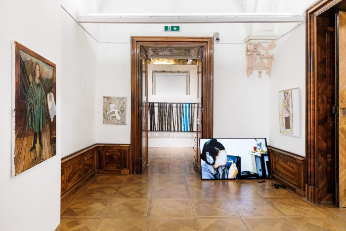 Screen leaning on wall in Exhibition amidst Baroque Interior.