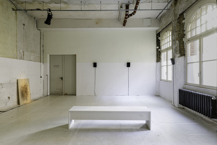 White Space with six speakers, a tap dance board, and a bench