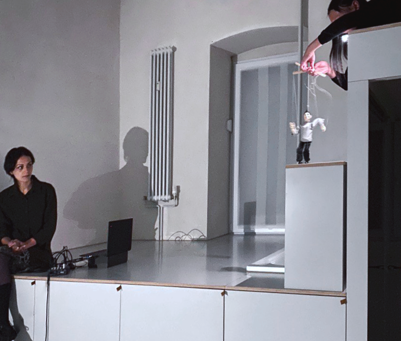 Person Speaking into microphone with winter jacket.