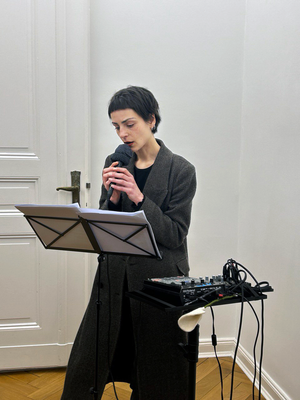 Person Speaking into microphone with winter jacket.