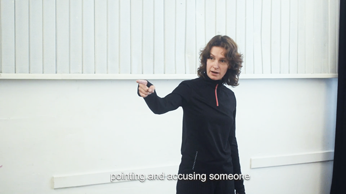 half total shot of woman pointing her finger in rehearsal space