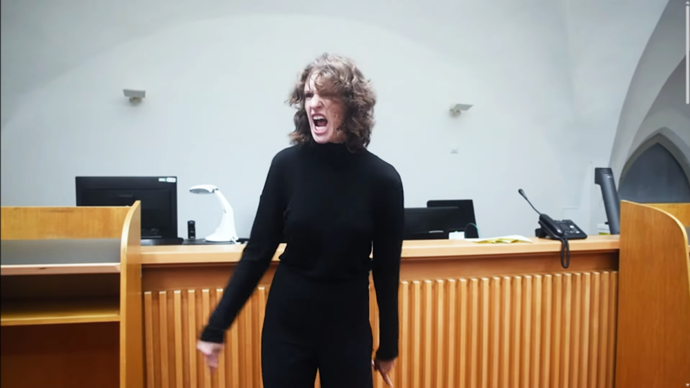 woman screaming in a courtroom