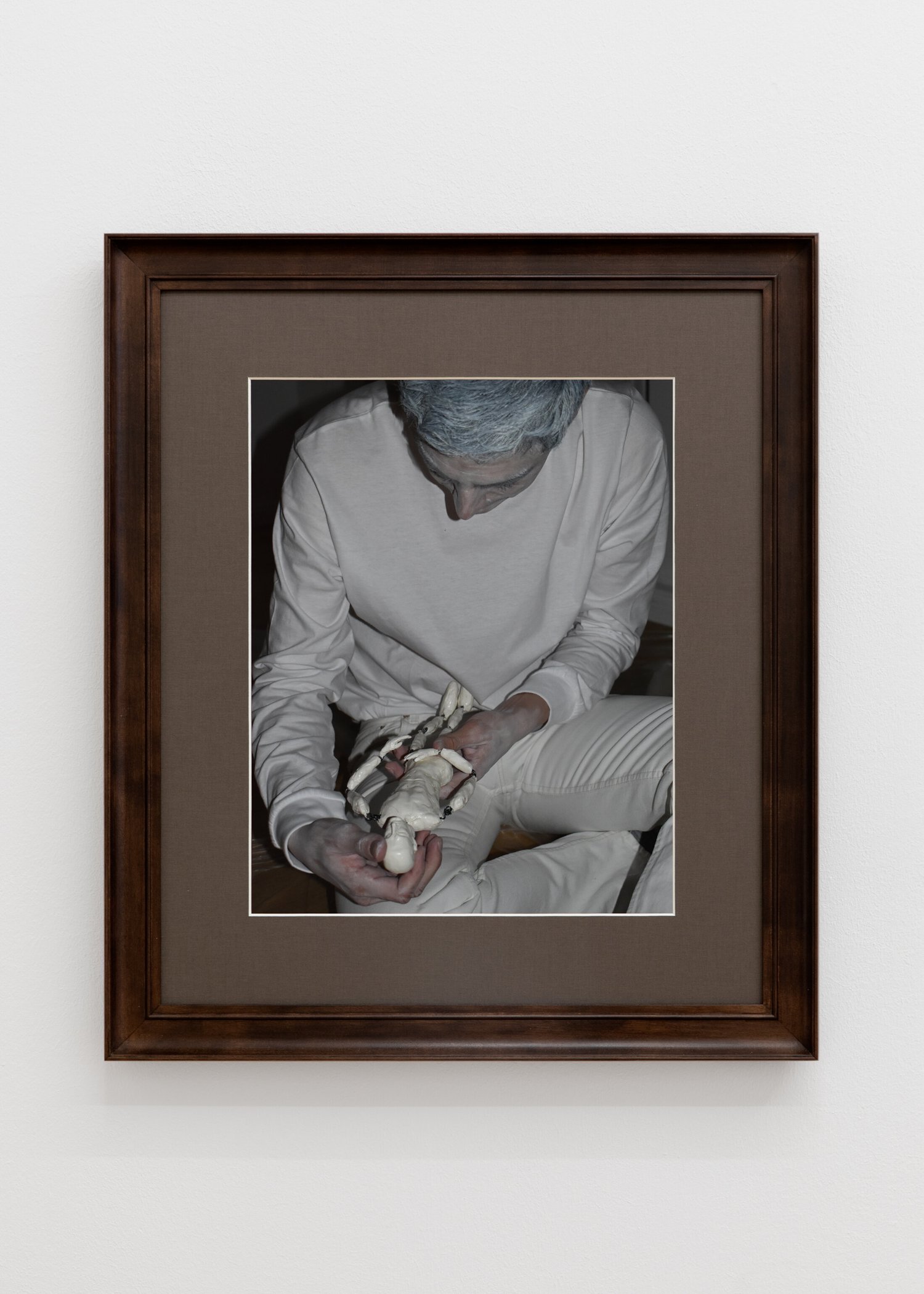 White Space with mirror foil on windows and photos hung on strings from ceiling