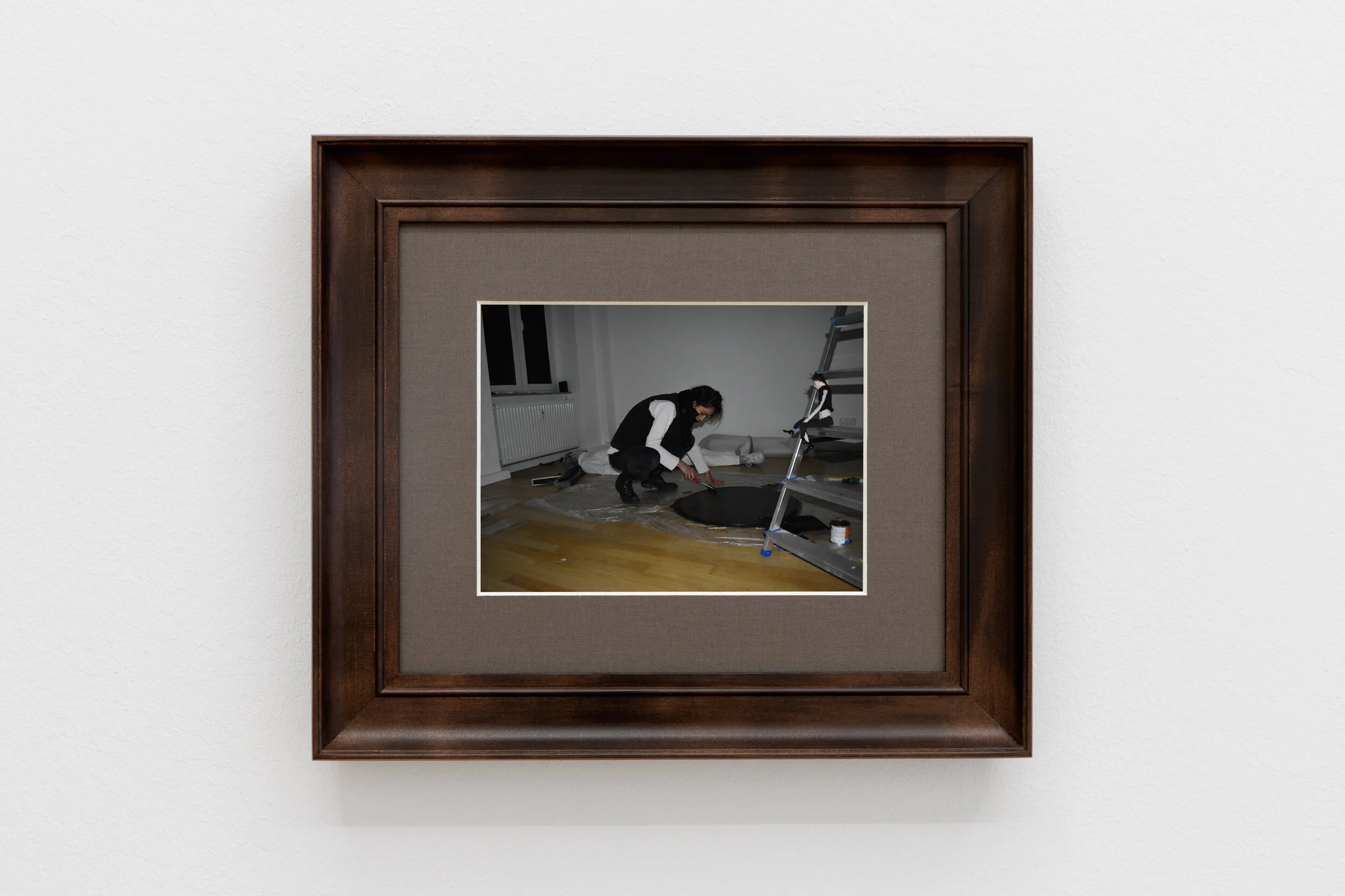 performer speaking into microphone in front of a facade, eyes looking up