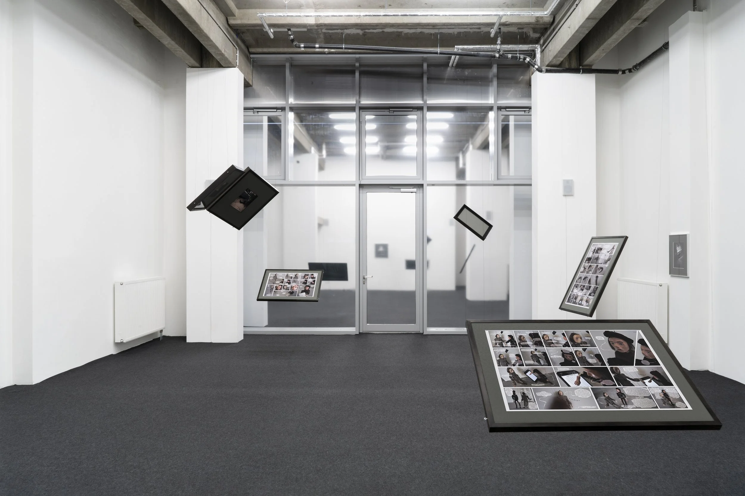 White Space with mirror foil on windows and photos hung on strings from ceiling